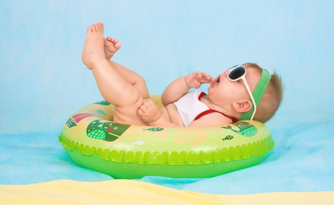 baby lying on inflatable ring